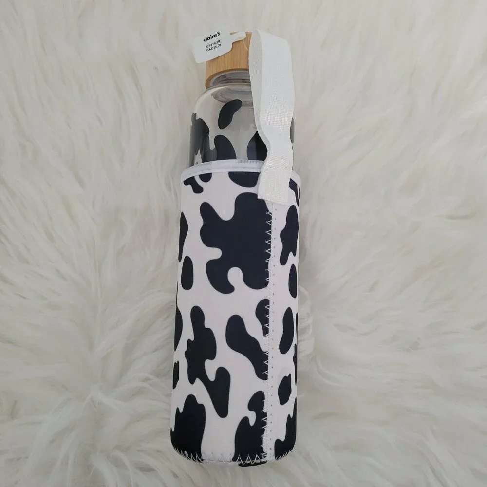 Claire's Cow Print Glass Water Bottle with Sleeve